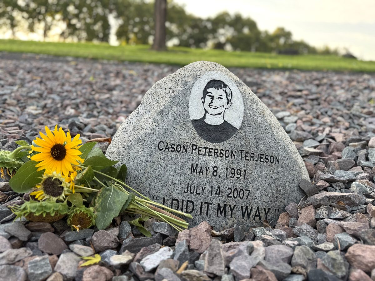 Cason’s memorial stone with sunflowers